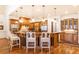 Well-equipped kitchen featuring custom wood cabinetry, granite countertops, and stainless steel appliances, ideal for cooking at 5352 Lacosta Ln, Alpharetta, GA 30022