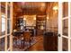 Wood-paneled office with built-in shelves and a cozy fireplace at 5352 Lacosta Ln, Alpharetta, GA 30022