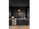 Stylish bar area with dark cabinetry, stone countertops, and a wine refrigerator at 2583 Apple Valley Rd, Brookhaven, GA 30319