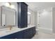 Modern bathroom with a double sink vanity, tub, and tile flooring at 2583 Apple Valley Rd, Brookhaven, GA 30319