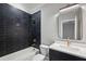 Well-lit bathroom featuring a tub-shower combo, modern vanity, and stylish fixtures at 2583 Apple Valley Rd, Brookhaven, GA 30319
