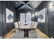 Elegant dining room featuring a dark wood table, stylish chairs, and striking wall art at 2583 Apple Valley Rd, Brookhaven, GA 30319