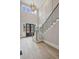 Bright, two-story foyer with hardwood floors, staircase, and modern light fixture at 2583 Apple Valley Rd, Brookhaven, GA 30319