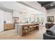 Gourmet kitchen boasts a large marble island, modern lighting, and stainless steel appliances at 2583 Apple Valley Rd, Brookhaven, GA 30319