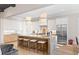 Modern kitchen with marble countertops, stainless steel refrigerator, and a breakfast bar at 2583 Apple Valley Rd, Brookhaven, GA 30319