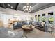 Open-concept living area with a sofa, arm chair, and access to a kitchen at 2583 Apple Valley Rd, Brookhaven, GA 30319