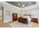 Bright main bedroom with hardwood floors, tray ceiling, elegant furniture, and natural light at 2583 Apple Valley Rd, Brookhaven, GA 30319