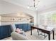 Comfortable home office featuring custom built-ins, desk, two armchairs, and natural light at 2583 Apple Valley Rd, Brookhaven, GA 30319