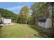 Picture of backyard with shed, mature trees, playset and lawn at 313 Ridge Hill Cir, Canton, GA 30115