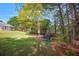 Beautiful backyard featuring a lawn, trees and play structures at 313 Ridge Hill Cir, Canton, GA 30115