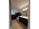 This bathroom features a single sink vanity and black wainscoting at 313 Ridge Hill Cir, Canton, GA 30115