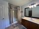 Bathroom showcasing a walk-in shower, vanity, and well-lit mirror at 313 Ridge Hill Cir, Canton, GA 30115