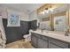 Charming bathroom featuring dark wainscoting, a large mirror, and a light-colored countertop at 313 Ridge Hill Cir, Canton, GA 30115