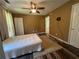 This bedroom features a ceiling fan and multiple closets and doors at 313 Ridge Hill Cir, Canton, GA 30115