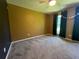 Bedroom featuring neutral carpeting, a ceiling fan and large window at 313 Ridge Hill Cir, Canton, GA 30115