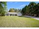 Well-kept home featuring a landscaped front yard, and neutral siding, with a two car garage at 313 Ridge Hill Cir, Canton, GA 30115