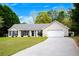 Charming single-story home with a well-manicured lawn and an attached two-car garage at 313 Ridge Hill Cir, Canton, GA 30115