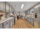 Bright kitchen featuring gray cabinets, stainless steel appliances, and hardwood floors at 313 Ridge Hill Cir, Canton, GA 30115