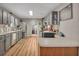 Spacious kitchen with gray cabinetry, stainless steel appliances, and hardwood floors at 313 Ridge Hill Cir, Canton, GA 30115