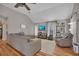 Bright living room with vaulted ceilings, wood floors, and a comfortable gray sofa at 313 Ridge Hill Cir, Canton, GA 30115