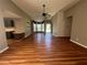 Spacious living room featuring hardwood floors and a view of the home's entryway at 313 Ridge Hill Cir, Canton, GA 30115