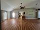 Spacious living room featuring hardwood floors, ceiling fan, modern decor and large windows at 313 Ridge Hill Cir, Canton, GA 30115