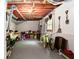 Basement featuring painted floor, bikes, tools, storage and a metal support beam at 3612 Tree View Dr, Snellville, GA 30078