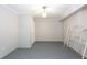 Basement featuring painted floor, drop light, closet and metal bed frame at 3612 Tree View Dr, Snellville, GA 30078