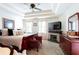 A spacious main bedroom with a trey ceiling, a fireplace, and a flat screen tv at 3612 Tree View Dr, Snellville, GA 30078