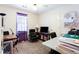 Office/bedroom space with desk area, tv, and lots of room for activities at 3612 Tree View Dr, Snellville, GA 30078