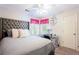Comfortable bedroom with a large bed, glass top desk, and lots of natural light at 3612 Tree View Dr, Snellville, GA 30078