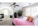Bright bedroom featuring sloped ceilings and two windows with lots of natural light at 3612 Tree View Dr, Snellville, GA 30078