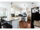 An updated kitchen with granite countertops, stainless steel appliances, and dark backsplash at 3612 Tree View Dr, Snellville, GA 30078