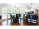 A bright kitchen and dining area with granite countertops, stainless steel appliances, and lots of windows at 3612 Tree View Dr, Snellville, GA 30078