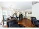 An open-concept living and kitchen area with hardwood floors and lots of natural light at 3612 Tree View Dr, Snellville, GA 30078