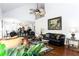 Comfortable living room featuring vaulted ceilings, large windows, and stylish furnishings at 3612 Tree View Dr, Snellville, GA 30078
