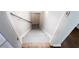 Stairwell featuring wooden stairs, white walls, wooden railing, and hardwood floors at 3612 Tree View Dr, Snellville, GA 30078
