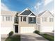 Charming two-story townhome with a brick facade, attached garage, and blue accents at 813 Cygnet Ln, Grayson, GA 30017