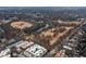 Picturesque aerial view of a city park with a pond and winding trails, surrounded by residential buildings at 855 Peachtree Ne St # 1508, Atlanta, GA 30308