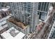A high-rise condo featuring multiple balconies and floor-to-ceiling windows, surrounded by trees at 855 Peachtree Ne St # 1508, Atlanta, GA 30308