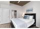 Cozy bedroom with a view to a walk-in closet, featuring hardwood floors and serene decor at 855 Peachtree Ne St # 1508, Atlanta, GA 30308