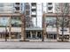 Street view of building's entrance and surrounding shops at 855 Peachtree Ne St # 1508, Atlanta, GA 30308