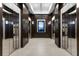 Hallway with mirrored elevators and modern lighting at 855 Peachtree Ne St # 1508, Atlanta, GA 30308