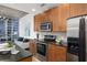 Well-equipped kitchen with granite countertops, stainless steel appliances, and modern wood cabinetry at 855 Peachtree Ne St # 1508, Atlanta, GA 30308