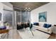 Cozy living room with large windows offering a cityscape view and stylish decor at 855 Peachtree Ne St # 1508, Atlanta, GA 30308