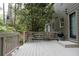 Back porch with outdoor seating area including a grill and foliage at 1143 Morningside Ne Pl, Atlanta, GA 30306