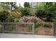 Inviting backyard view from the deck, featuring lush landscaping and colorful azalea bushes at 1143 Morningside Ne Pl, Atlanta, GA 30306
