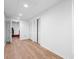 Finished basement area with modern flooring, neutral walls and recessed lighting, and storage closets at 1143 Morningside Ne Pl, Atlanta, GA 30306