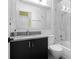 Elegant bathroom with a modern vanity, granite countertop, and a walk-in shower featuring marble at 1143 Morningside Ne Pl, Atlanta, GA 30306