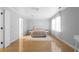 Bright bedroom features hardwood floors, white walls, and a plush area rug creating a cozy atmosphere at 1143 Morningside Ne Pl, Atlanta, GA 30306